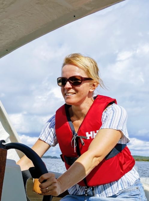 yvonne driving a boat